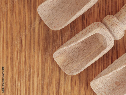 Wooden scoops shovels for spices and bulk products top view close up