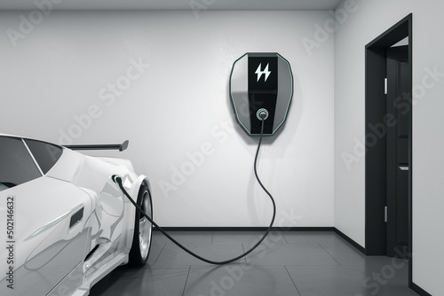 Modern white electric car in a light garage charging with a home electricity power charger on the wall. 3D rendering