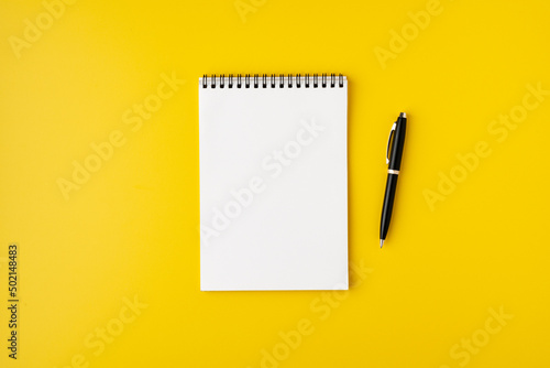 Wallpaper Mural Blank spiral notebook with fountain pen on colorful yellow background, top view, copyspace Torontodigital.ca