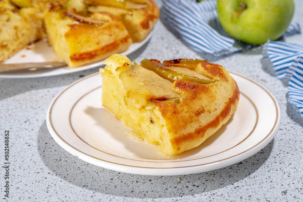 Classic upside-down apple cake. Retro apple cake recipe, cooked in frying pan easy autumn summer homemade baking sweet pastry, with fresh green apples copy space Classic upside-down apple cake. Retro apple cake recipe, cooked in frying pan easy autumn summer homemade baking sweet pastry, with fresh green apples copy space