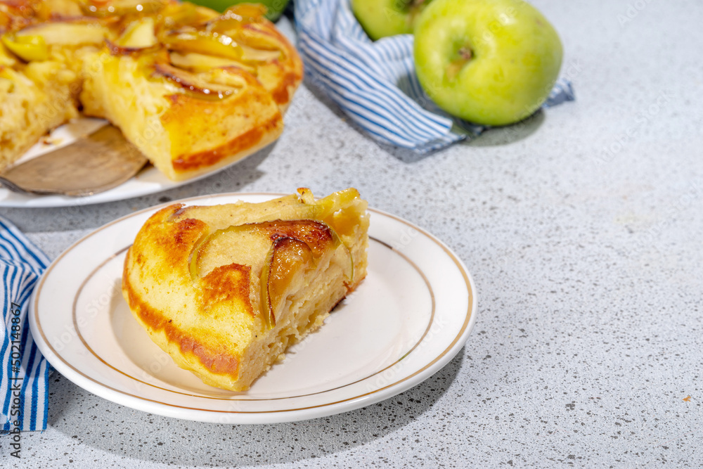 Classic upside-down apple cake. Retro apple cake recipe, cooked in frying pan easy autumn summer homemade baking sweet pastry, with fresh green apples copy space Classic upside-down apple cake. Retro apple cake recipe, cooked in frying pan easy autumn summer homemade baking sweet pastry, with fresh green apples copy space