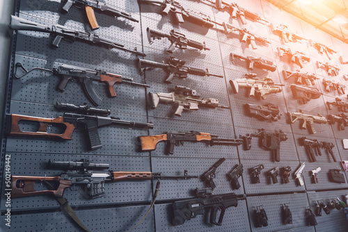 Collection of rifles and carbines on the wall photo