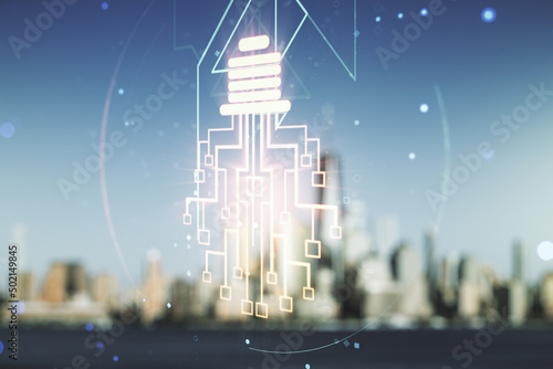 Virtual creative light bulb illustration with microcircuit on blurry skyscrapers background, future technology concept. Multiexposure