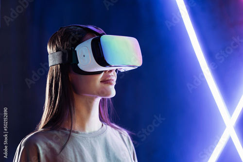 Obraz na plátne Young woman using virtual reality headset, VR, future, gadgets, technology, education online, studying, video game concept