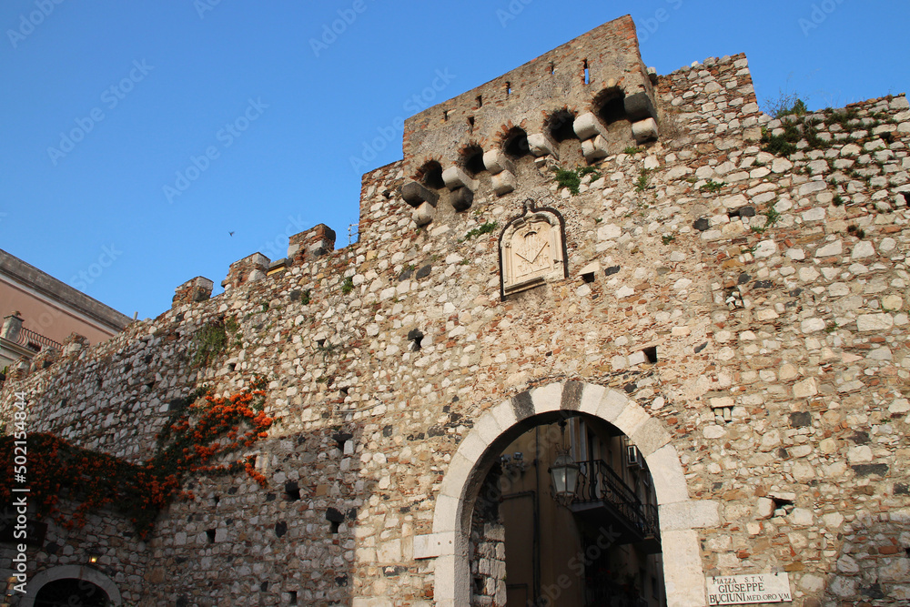 medieval gate (porta catania) in taormina in sicily in italy 