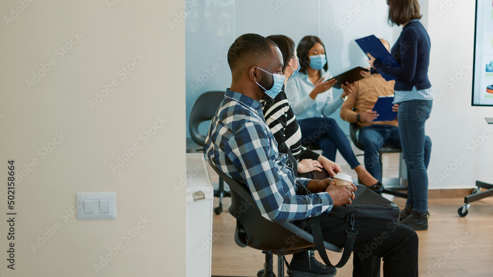 Obraz premium HR employee giving cv to job candidates waiting in queue, feeling stressed about interview and job application. Career and employment opportunity for applicants with resume, recruitment meeting.