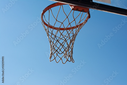 Old basketball goal against the blue sky, rear view, close-up © nuri