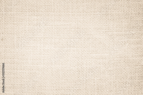 Jute hessian sackcloth burlap canvas woven texture background pattern in light beige cream brown color blank. 