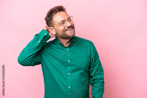 Middle age caucasian man isolated on pink background thinking an idea © luismolinero