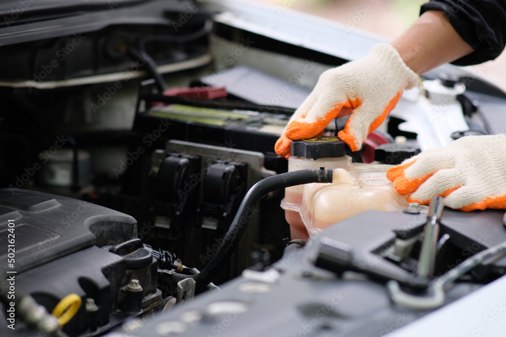Mechanic changing engine, Man checks the oil level in the engines after changing Mechanic changing engine, Man checks the oil level in the engines after changing