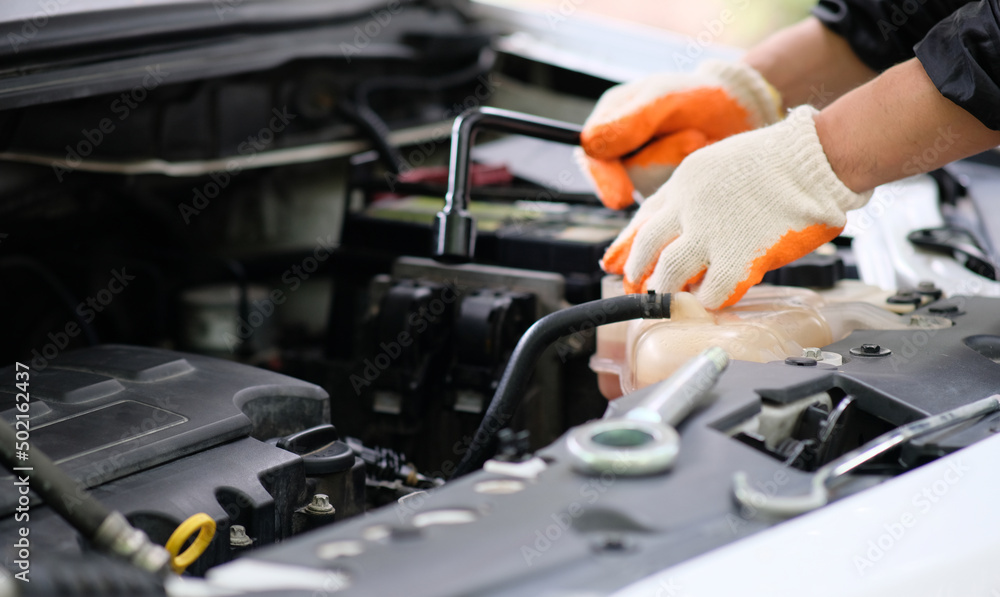 mechanic changing engine