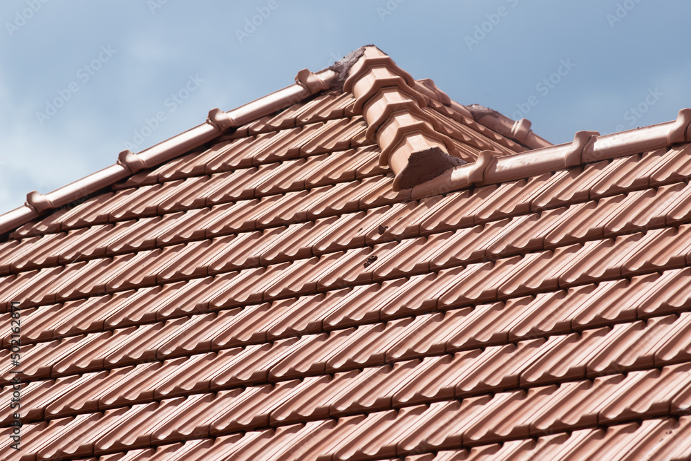 new red tiles roof and blue sky new red tiles roof and blue sky