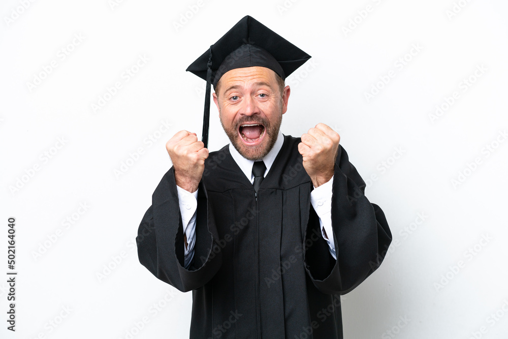 Middle age university graduate man isolated on white background celebrating a victory in winner position Middle age university graduate man isolated on white background celebrating a victory in winner position