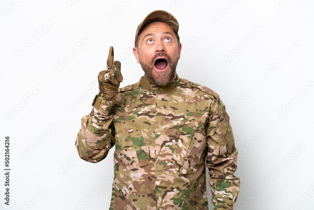 Military man isolated on white background pointing up and surprised Military man isolated on white background pointing up and surprised