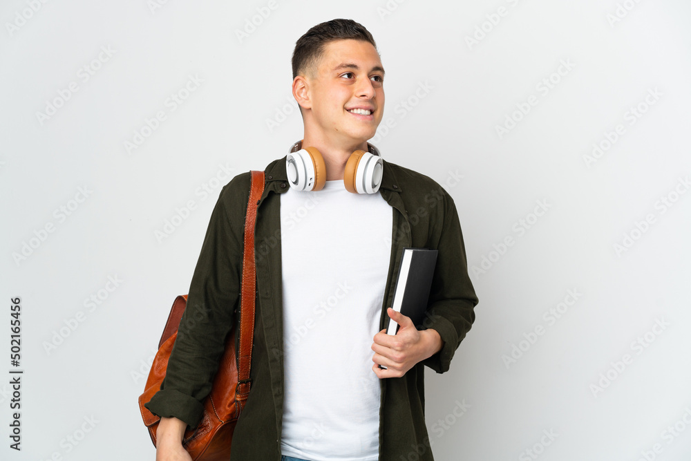 Young caucasian student man isolated on white background thinking an idea while looking up Young caucasian student man isolated on white background thinking an idea while looking up