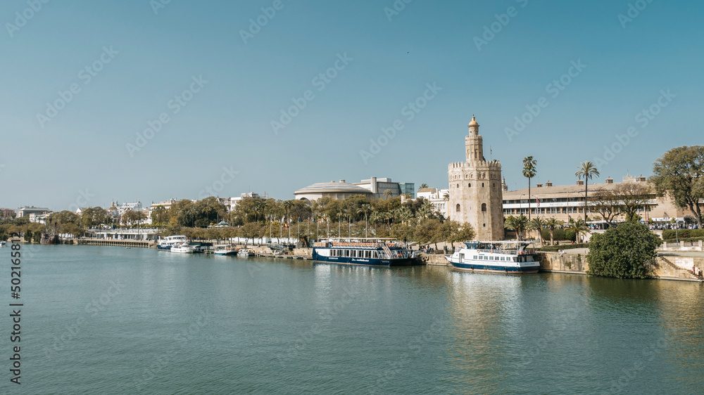 panoramic view of guadalquivir river in Seville and torre del oro