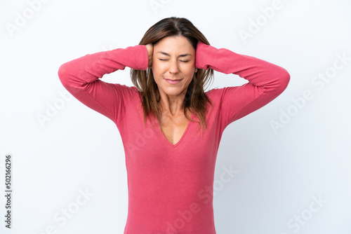 Middle age caucasian woman isolated on white background frustrated and covering ears