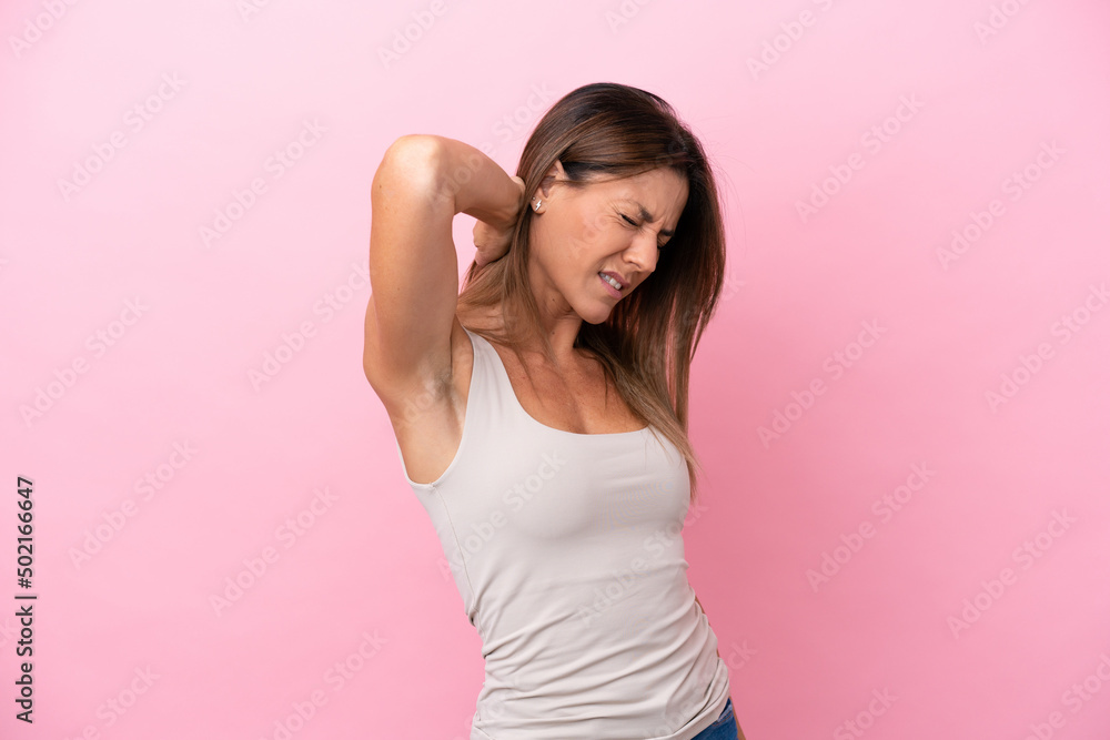 Middle age caucasian woman isolated on pink background with neckache Middle age caucasian woman isolated on pink background with neckache