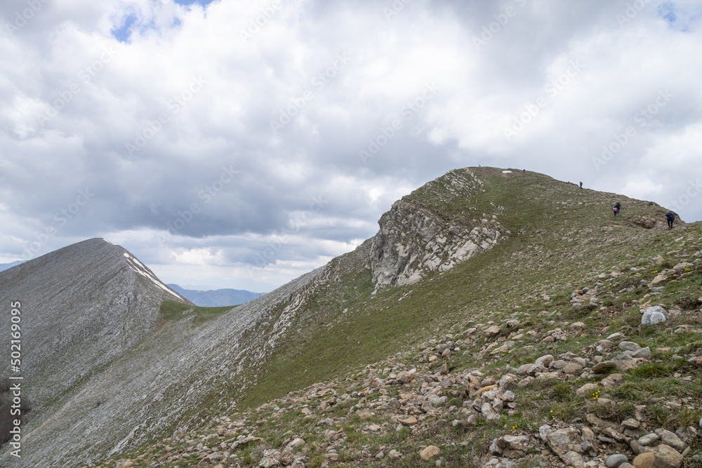 hikers reach the top of Monte Alpi. Monte Santa Croce, Pizzo Falcone, Lucan Apennines, Basilicata, Italy hikers reach the top of Monte Alpi. Monte Santa Croce, Pizzo Falcone, Lucan Apennines, Basilicata, Italy