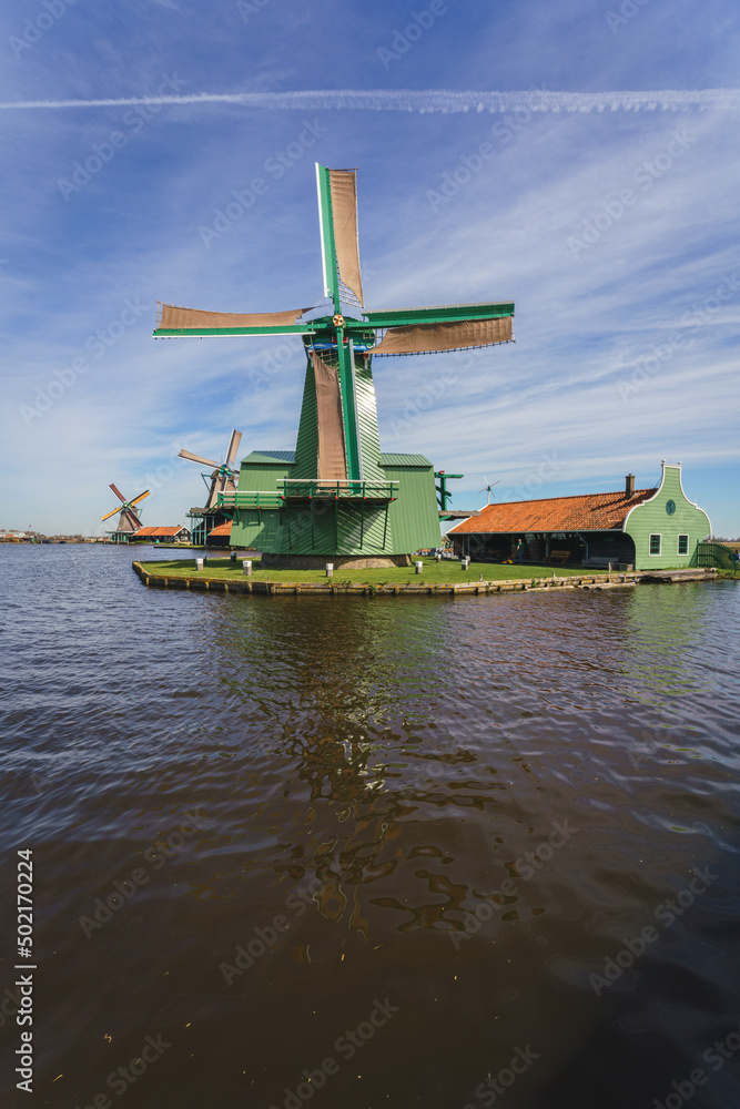 Historical buildings and windmills at dawn in Zaanse Schans, Netherlands