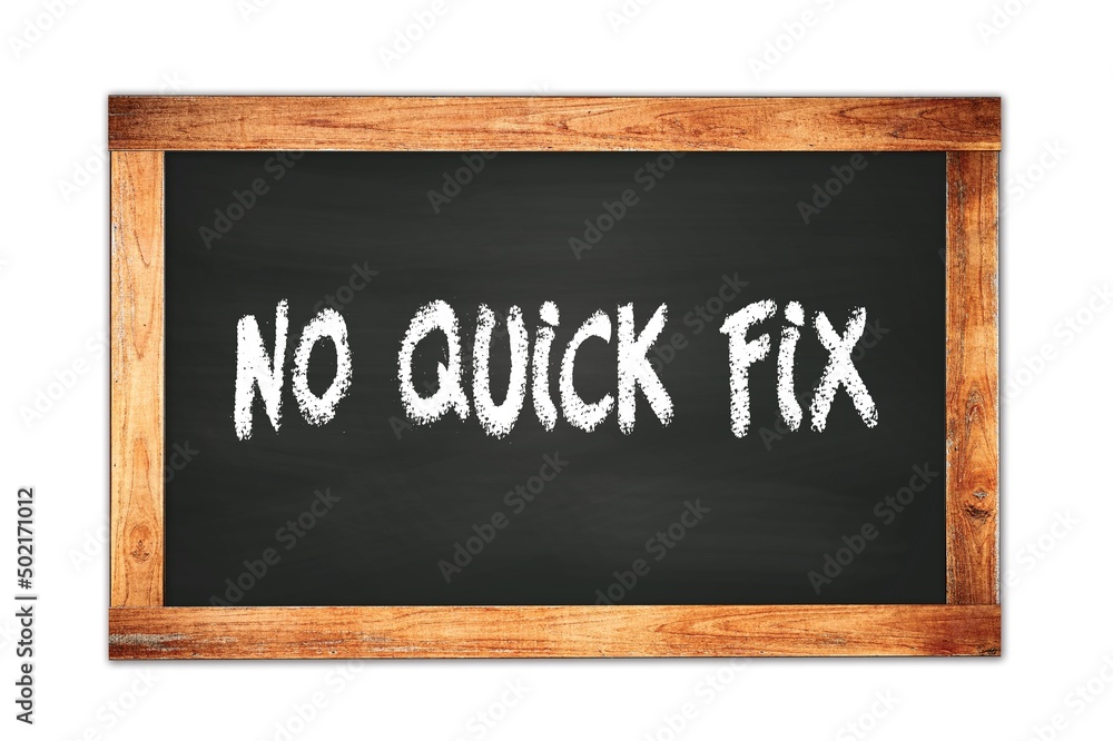 NO QUICK FIX text written on wooden frame school blackboard. NO QUICK FIX text written on wooden frame school blackboard.
