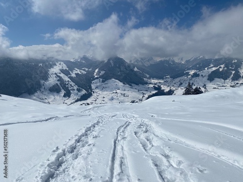 Wonderful winter hiking trails and traces on the slopes of the Alpstein mountain range and in the fresh alpine snow cover of the Swiss Alps, Nesslau - Obertoggenburg, Switzerland (Schweiz)