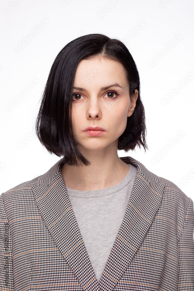 emotional woman in a gray t-shirt and jacket, white background emotional woman in a gray t-shirt and jacket, white background