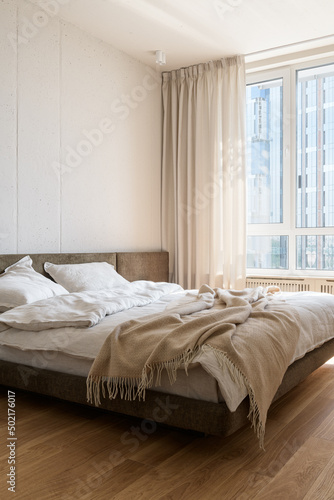 bedroom in white and beige tones, bedroom interior in loft style
