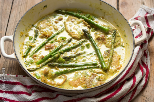 Pork chops with asparagus and green peas