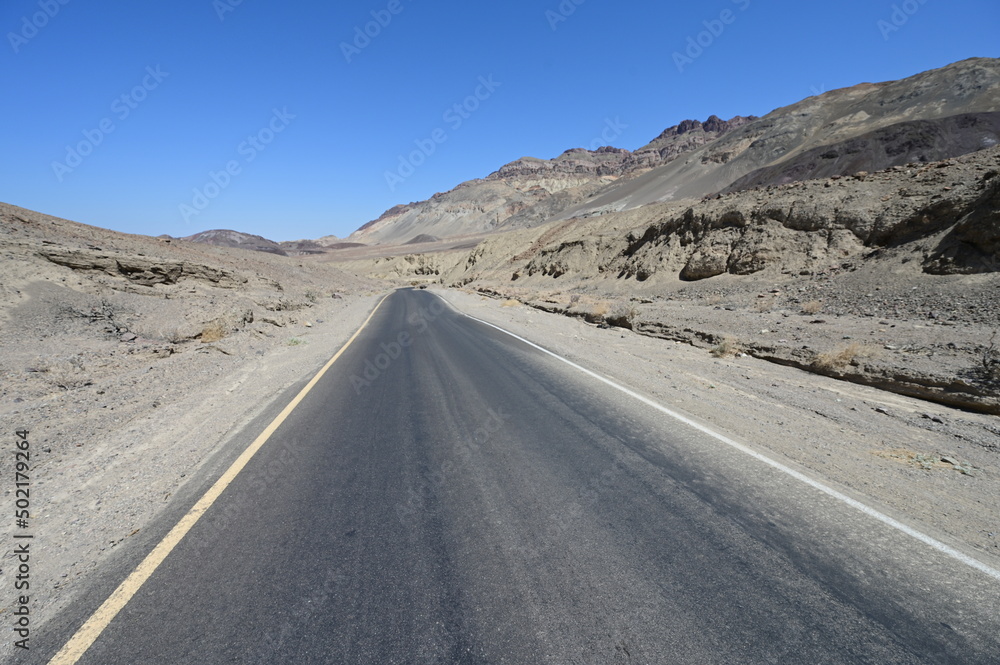 A tarmac road running through Death Valley in California.