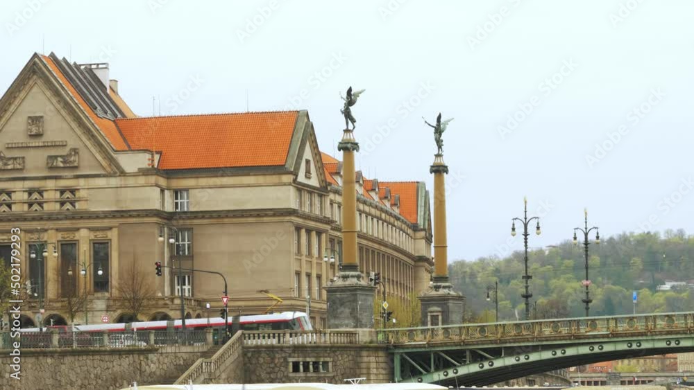 Building and bridge near river with two crossing trains. Building and bridge near river with two crossing trains.