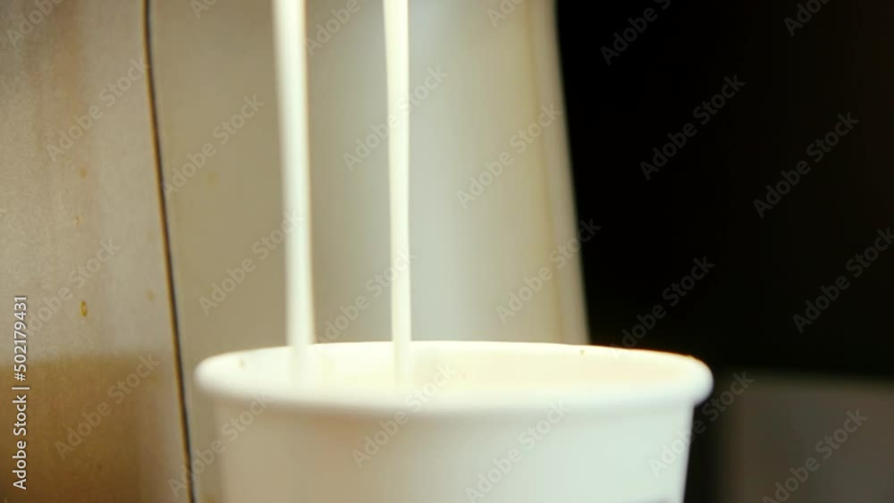 Coffee slowly pouring and dripping into cup on Express Vending machine close Coffee slowly pouring and dripping into cup on Express Vending machine close