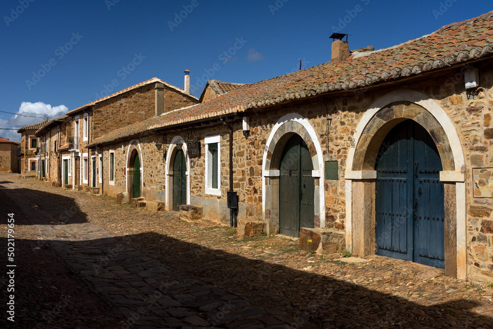 Street of Castrillo de los Polvazares village with the typical houses, Astorga, Leon, Spain.