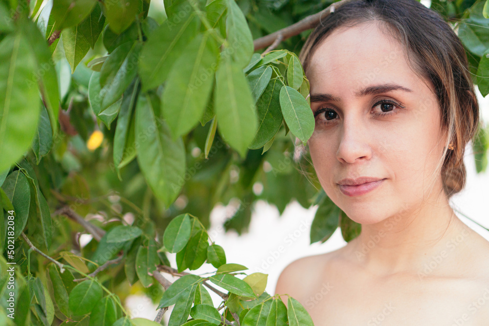 Portrait Of A Fashionable Woman With Plants In A Park Portrait Of A Fashionable Woman With Plants In A Park