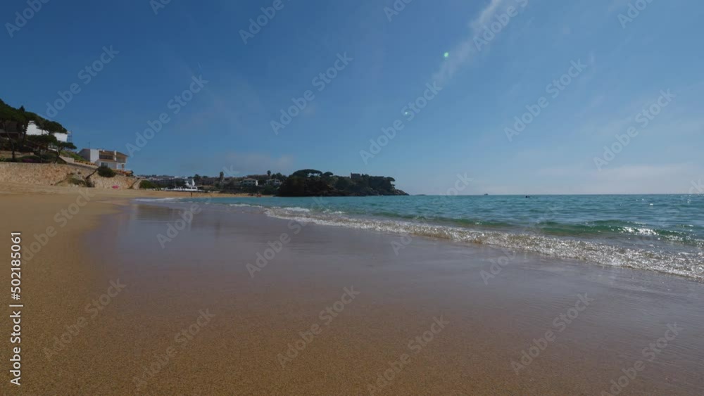 La Fosca beach in Girona Mediterranean sea without people paradisiacal blue turquoise blue sky slow motion La Fosca beach in Girona Mediterranean sea without people paradisiacal blue turquoise blue sky slow motion