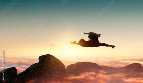 Female dancer against sunse...