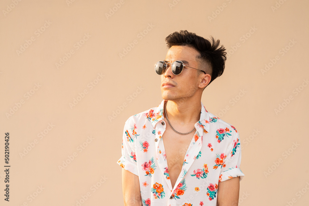 Portrait of handsome young cool man against plain background Portrait of handsome young cool man against plain background