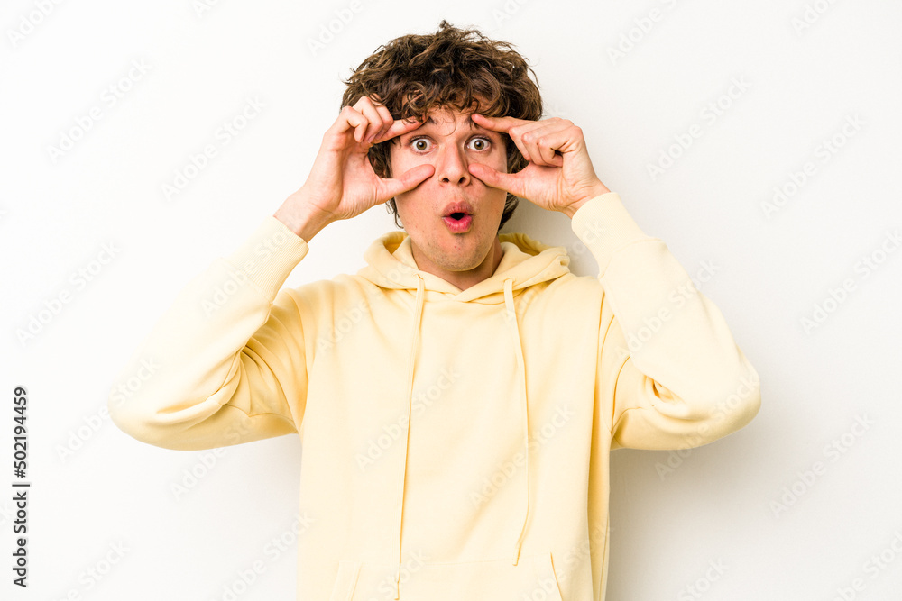 Young caucasian man isolated on white background keeping eyes opened to find a success opportunity. Young caucasian man isolated on white background keeping eyes opened to find a success opportunity.