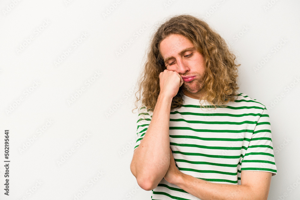 Young caucasian man isolated on white background who feels sad and pensive, looking at copy space. Young caucasian man isolated on white background who feels sad and pensive, looking at copy space.