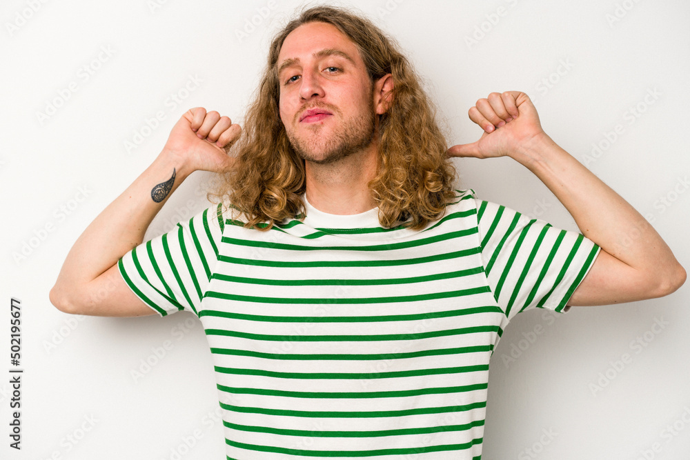 Young caucasian man isolated on white background feels proud and self confident, example to follow. Young caucasian man isolated on white background feels proud and self confident, example to follow.