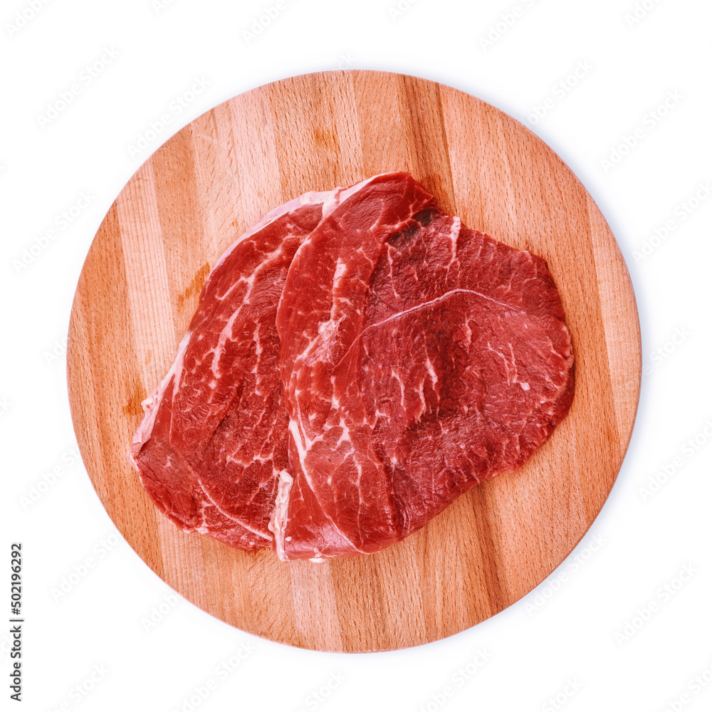 Raw meat for steak on wooden cutting board. Top view isolated with clipping path