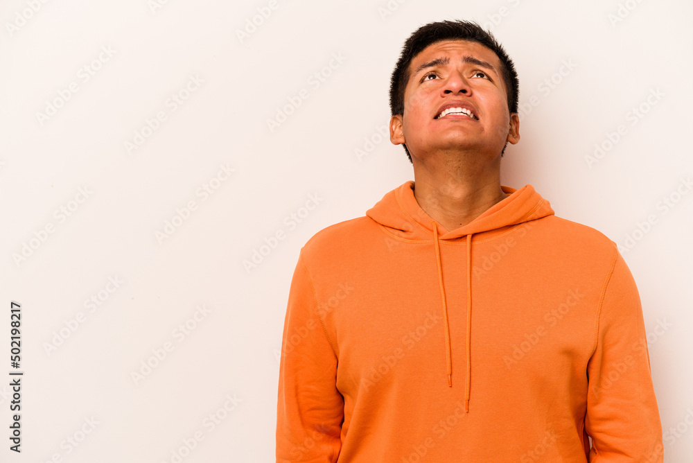 Young hispanic man isolated on white background shouting very angry, rage concept, frustrated. Young hispanic man isolated on white background shouting very angry, rage concept, frustrated.