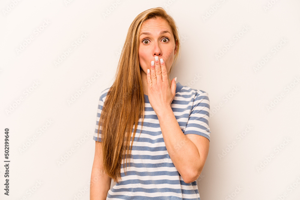 Young caucasian woman isolated on white background shocked, covering mouth with hands, anxious to discover something new. Young caucasian woman isolated on white background shocked, covering mouth with hands, anxious to discover something new.
