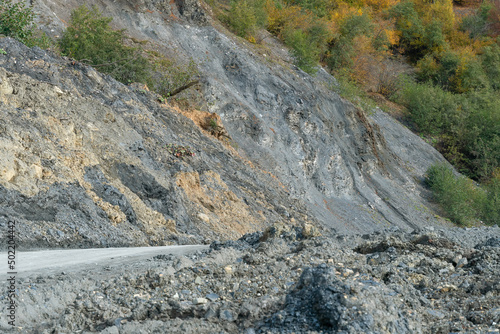 Принти на полотні Collapse of rock, sand on the serpentine road on a sunny autumn day