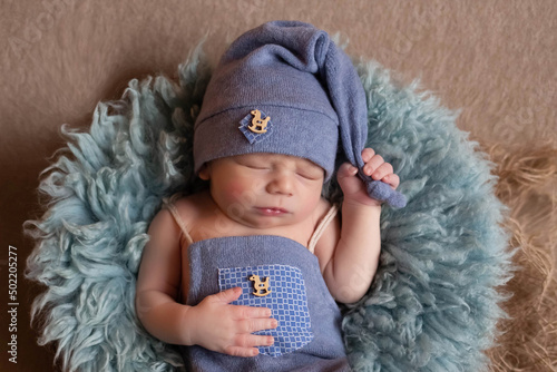 beautiful newborn baby sleeps in a