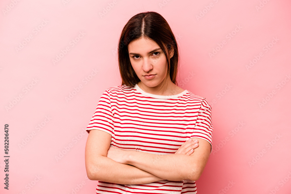 Young caucasian woman isolated on pink background who is bored, fatigued and need a relax day. Young caucasian woman isolated on pink background who is bored, fatigued and need a relax day.