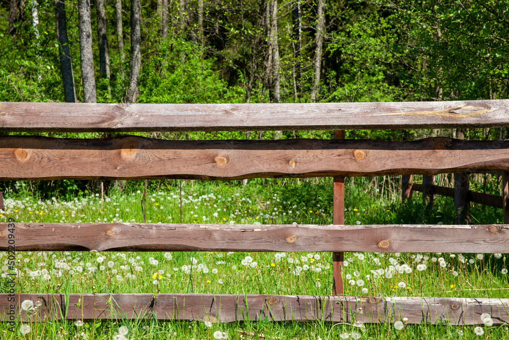 part of an old wooden fence with a lot of damage, part of an old wooden fence with a lot of damage,