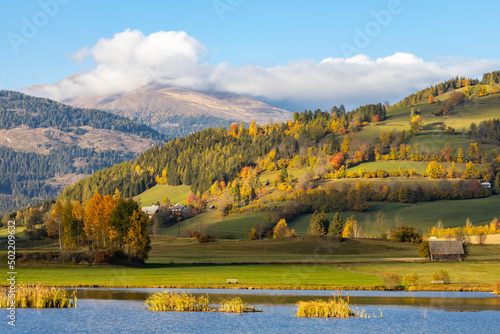 autumn pond under the mountains, Murau district,.Styria, Austria photo