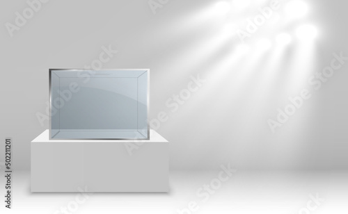 Glass showcase for the exhibition in the form of a cube. Background for sale illuminated by spotlights. Museum glass box isolated advertising or business design boutique. Exhibition hall.