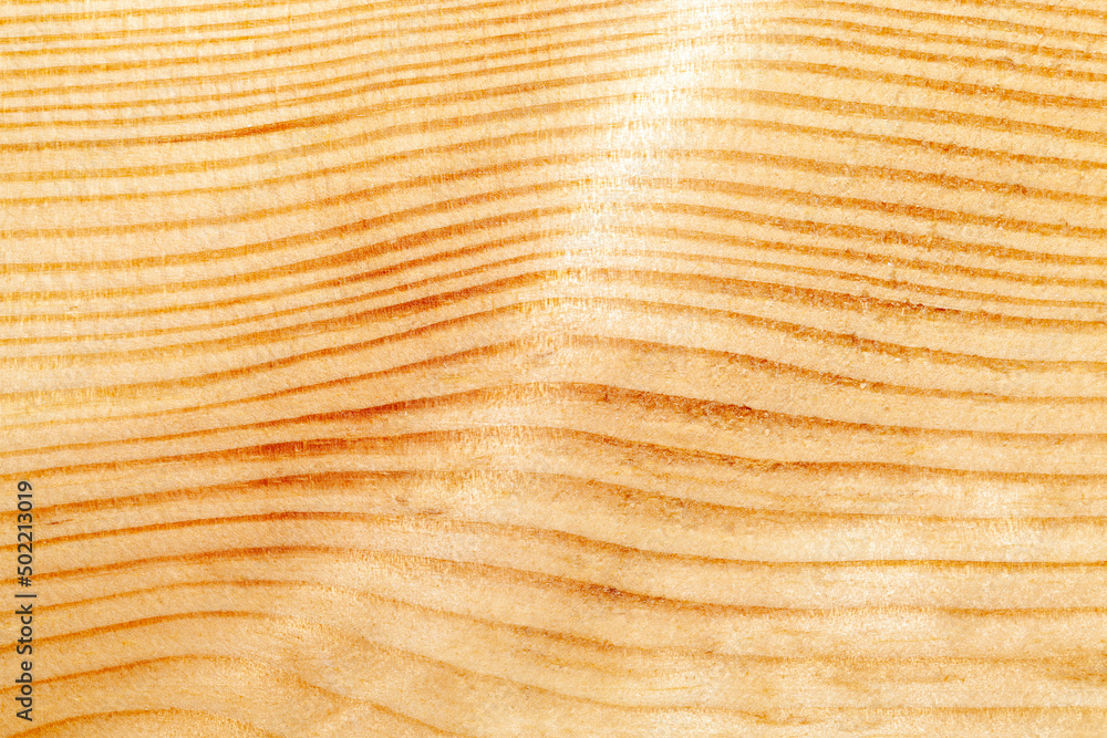 Fototapeta premium yellow-orange pine wood board during construction works,